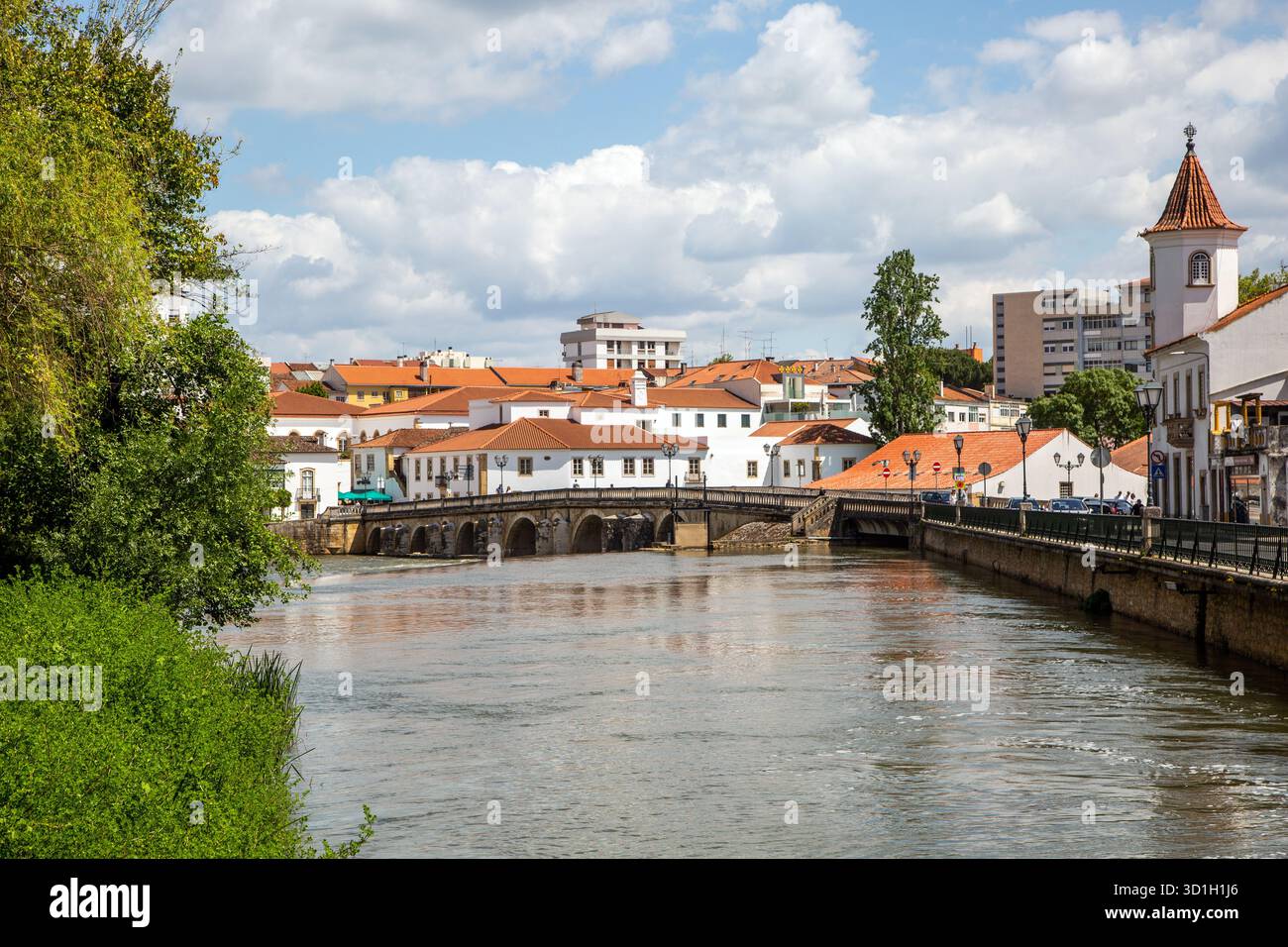 The river Rio Nabão as it flows through the Portuguese city of Tomar the former home of the Knights Templar Stock Photo