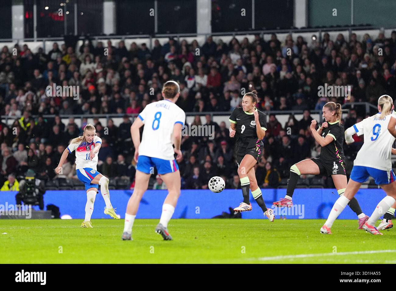England's Aggie Beever-Jones (left) scores their side's first goal ...