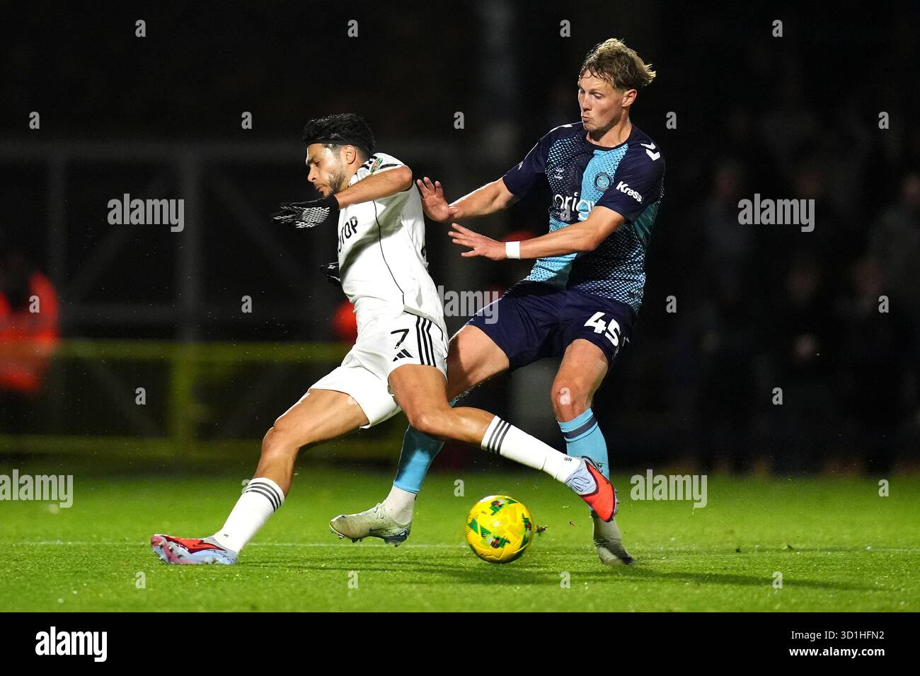 Fulham's Raul Jimenez (left) and Wycombe Wanderers' Anders Hagelskjaer ...