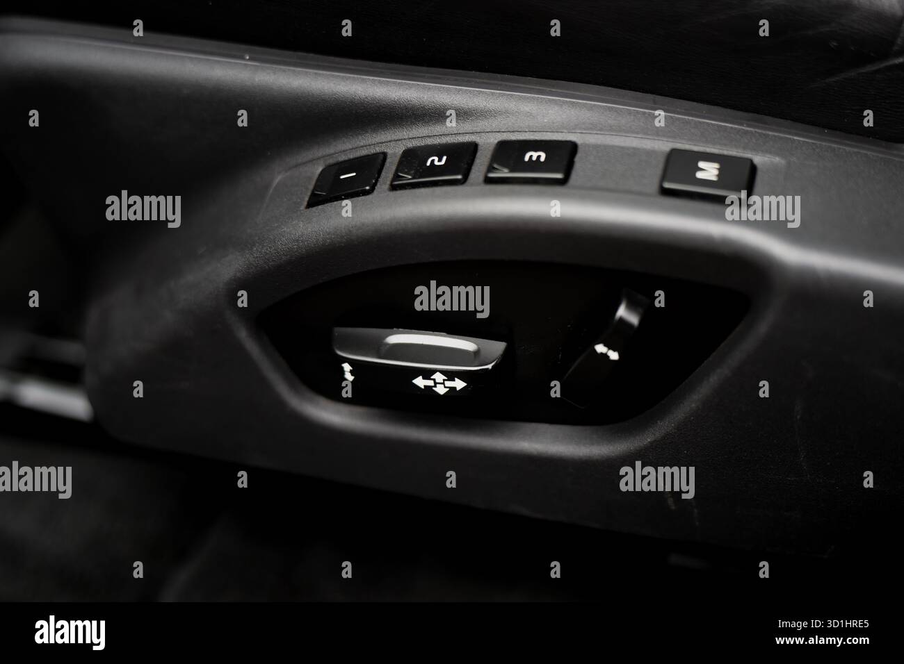 Luxury car interior detail featuring power seat adjustment controls and ...