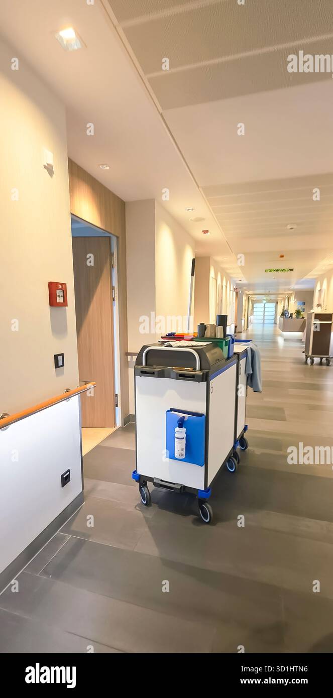 Belin, Germany - May 30, 2025: Housekeeping cart is positioned in a modern hotel corridor with sleek design features. Hospital - Smartphone Captured Stock Image