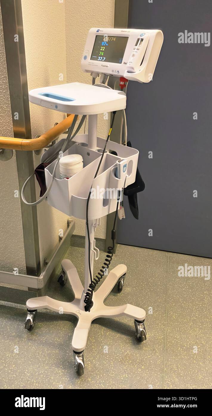 Belin, Germany - May 30, 2025: Mobile vital signs monitor is positioned in hospital corridor with copy space available. Hospital - Smartphone Captured Stock Image
