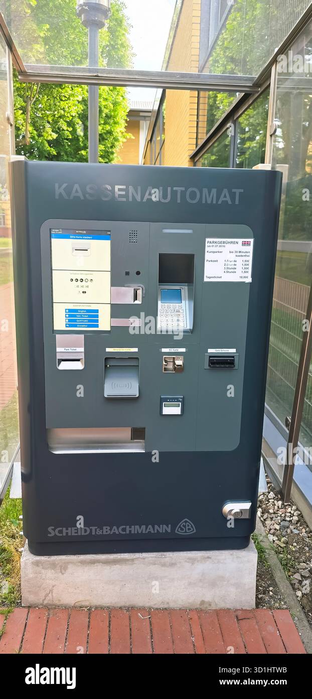 Belin, Germany - May 30, 2025: Kassenautomat payment machine by Scheidt Bachmann located in urban area with greenery. Hospital - Smartphone Captured Stock Image