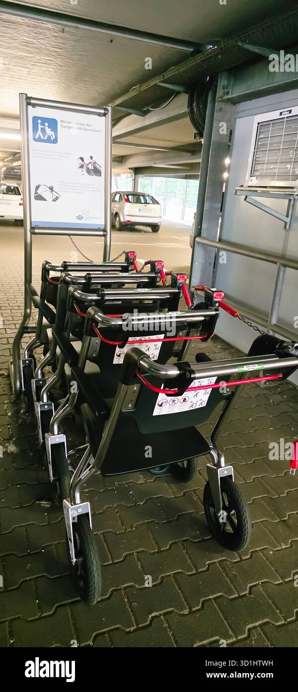 Belin, Germany - May 30, 2025: Accessible shopping carts are neatly arranged in parking garage for easy access. Hospital - Smartphone Captured Stock Image
