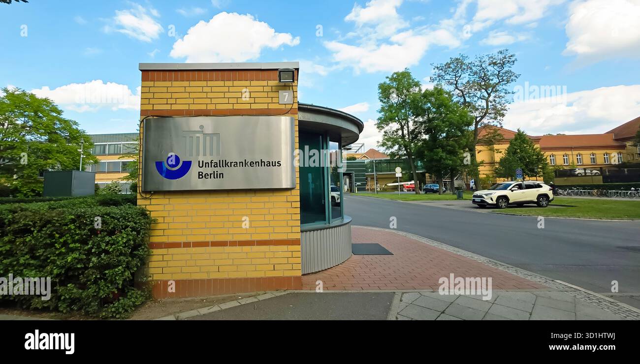 Belin, Germany - May 30, 2025: Entrance of Unfallkrankenhaus Berlin showcasing modern design and surrounding greenery. Hospital - Smartphone Captured Stock Image