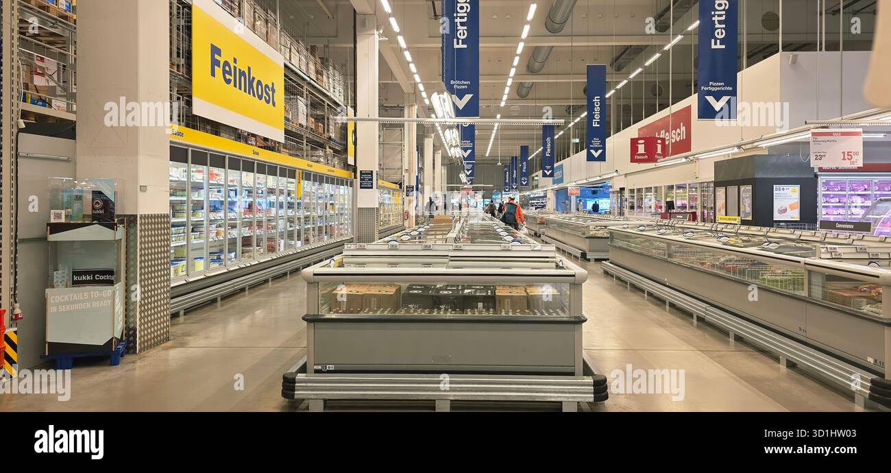 Belin, Germany - May 30, 2025: Supermarket interior features frozen food aisles with bright overhead lighting and organized displays. Hospital - Smartphone Captured Stock Image