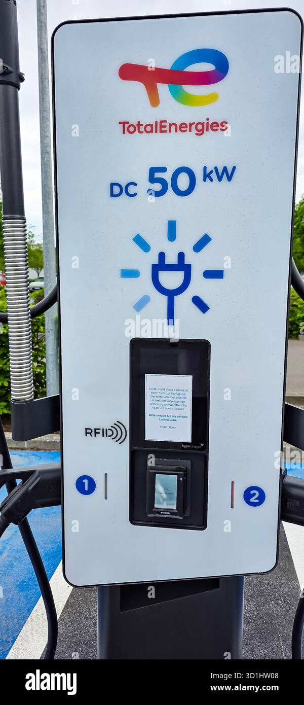 Berlin, Germany - May 03, 2025: TotalEnergies EV charging station displays power specifications and user interface clearly. - Smartphone Captured Stock Image