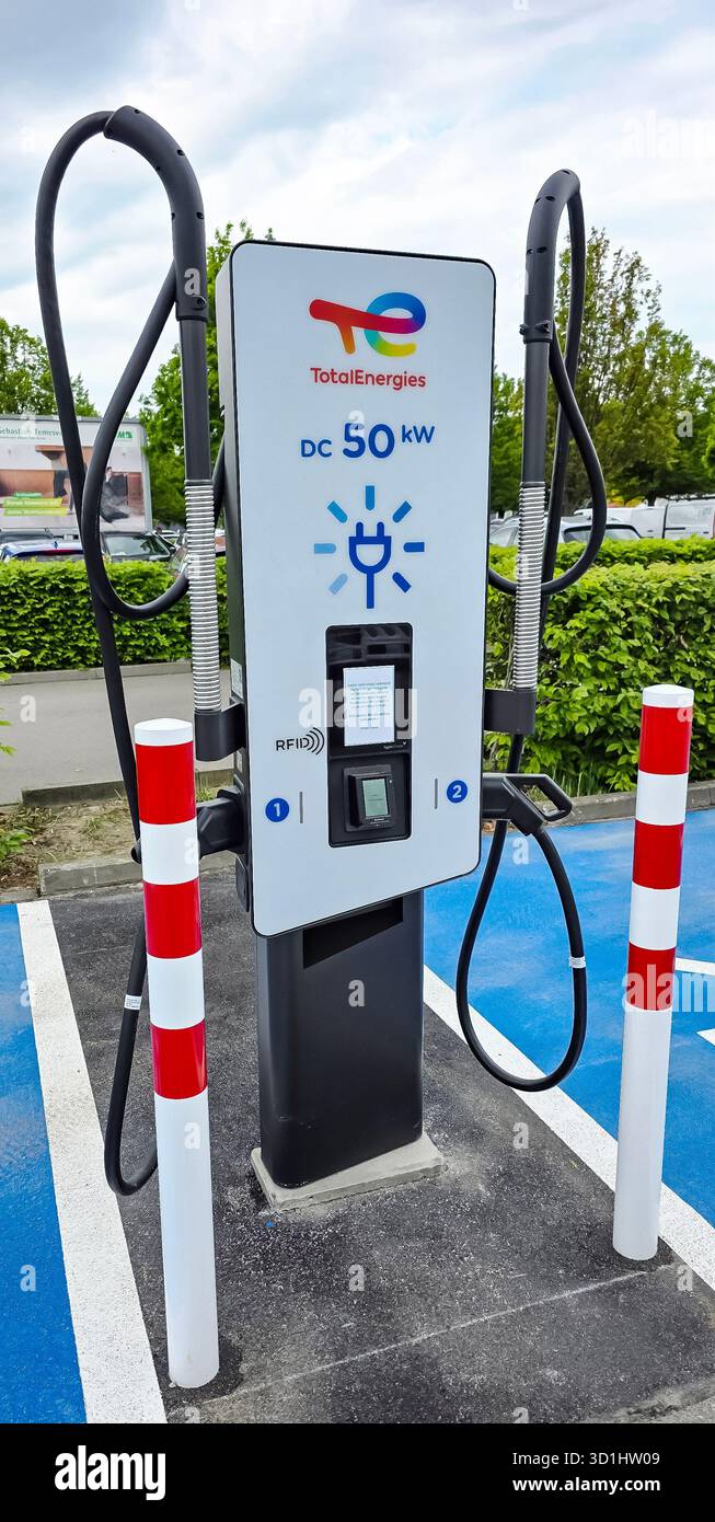 Berlin, Germany - May 03, 2025: Electric vehicle charging station by TotalEnergies features sleek design and efficient charging capabilities. - Smartphone Captured Stock Image