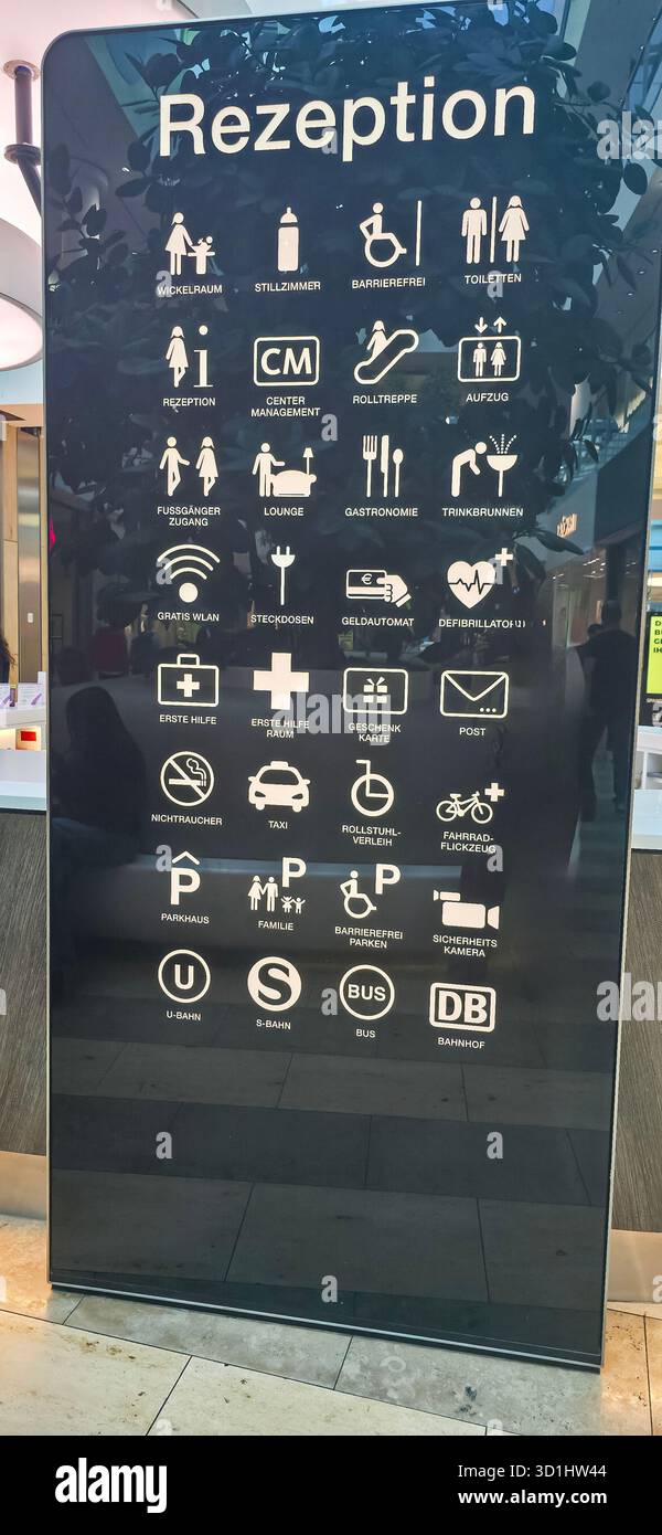 Berlin, Germany - May 13, 2025: Reception sign displays various icons for services and amenities available in the facility. - Smartphone Captured Stock Image