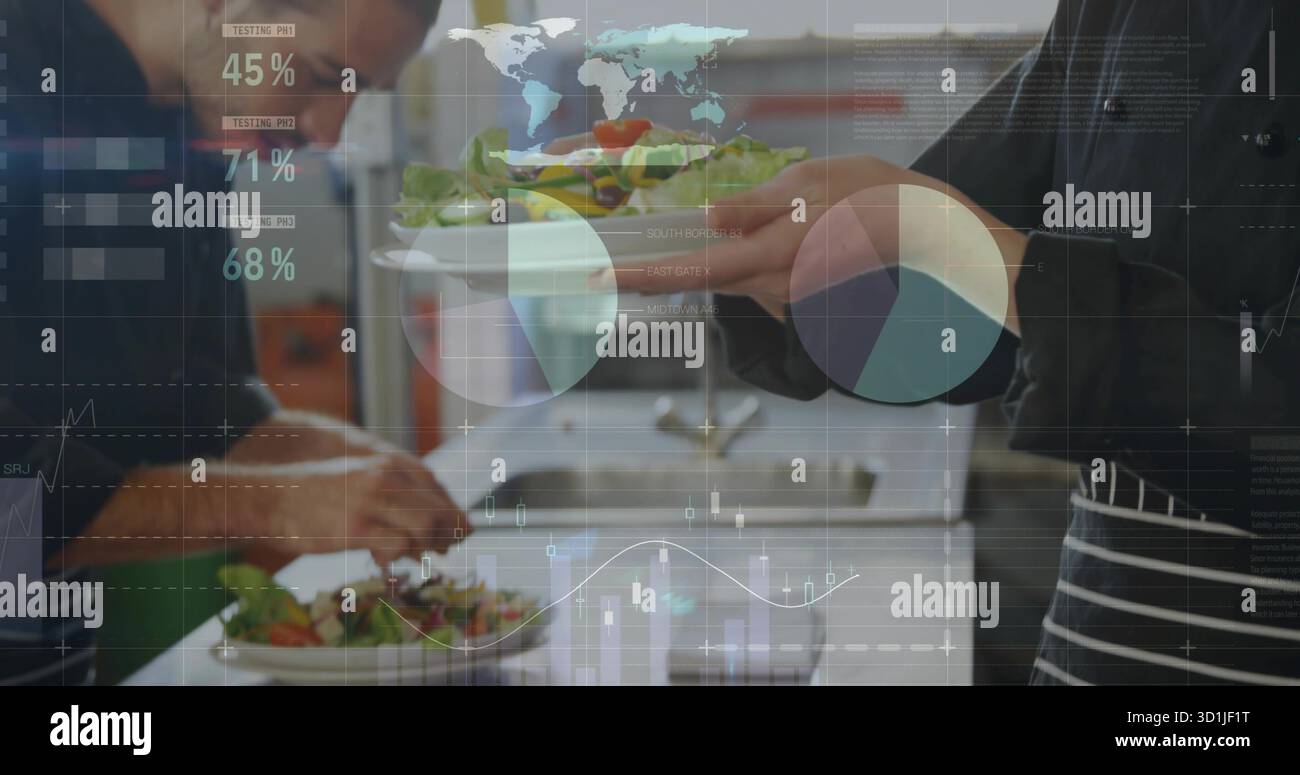 Working chefs wearing aprons plating fresh salads on plates in restaurant kitchen, data overlays Stock Photo