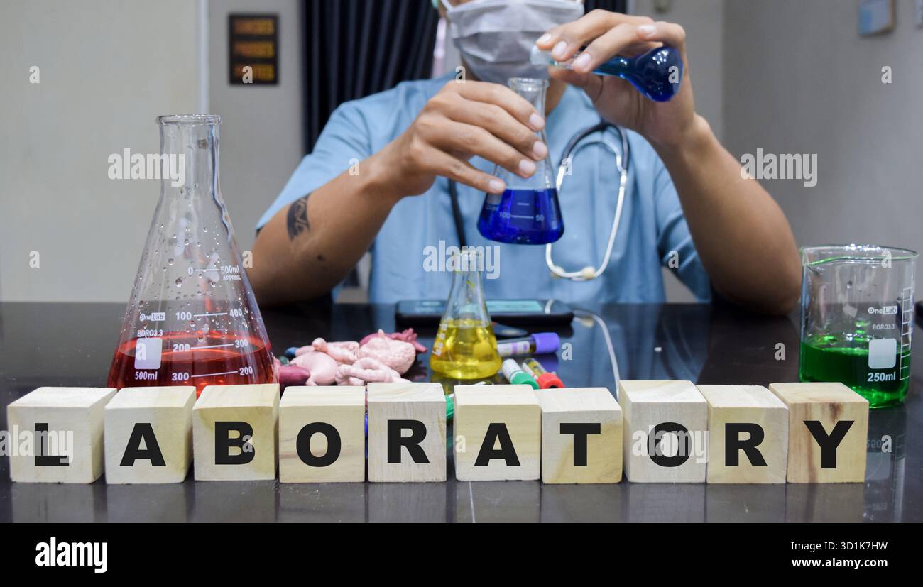 Lap Lab A laboratory technician lap setup with glassware and various effective ...