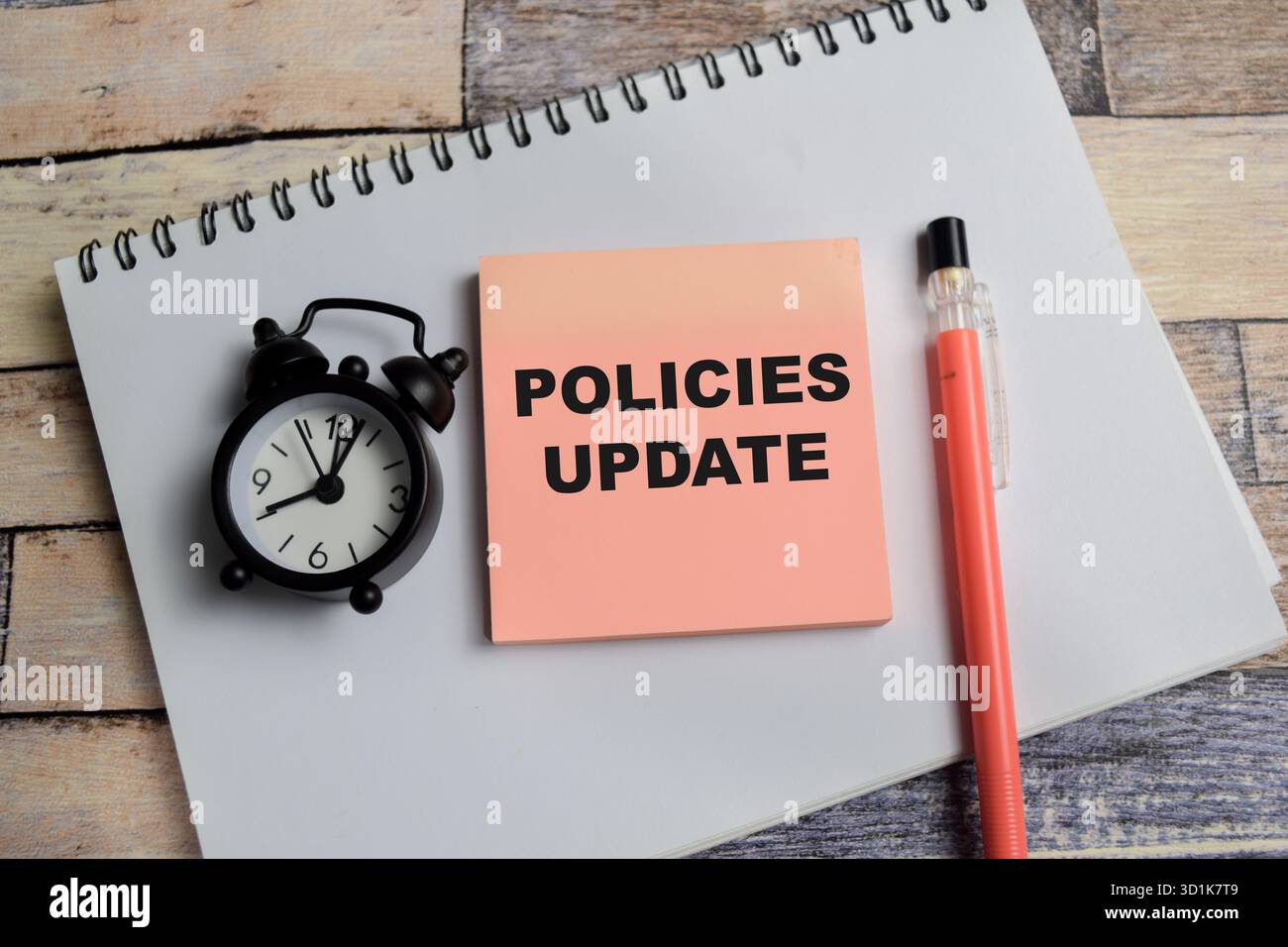 Concept of policies update write on sticky notes isolated on Wooden ...