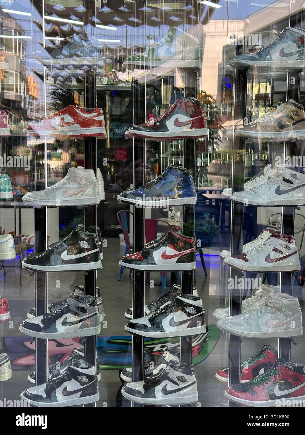 Nike trainers in shop window - Smartphone Captured Stock Image