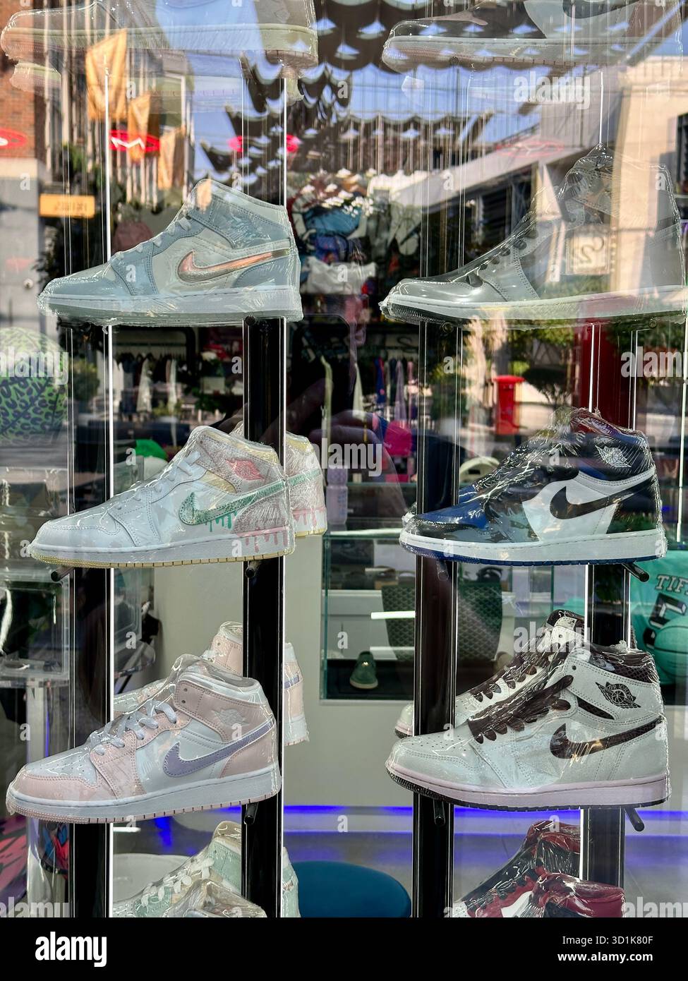 Nike trainers in shop window - Smartphone Captured Stock Image