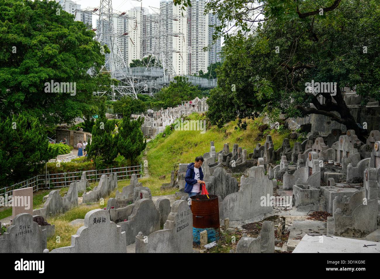 A man during paper offering at a cemetery on October 29, 2025 in Hong ...