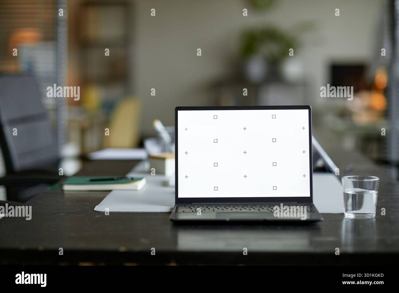 Laptop Computer Displaying Calibration Screen on Office Desk in Workspace Stock Photo