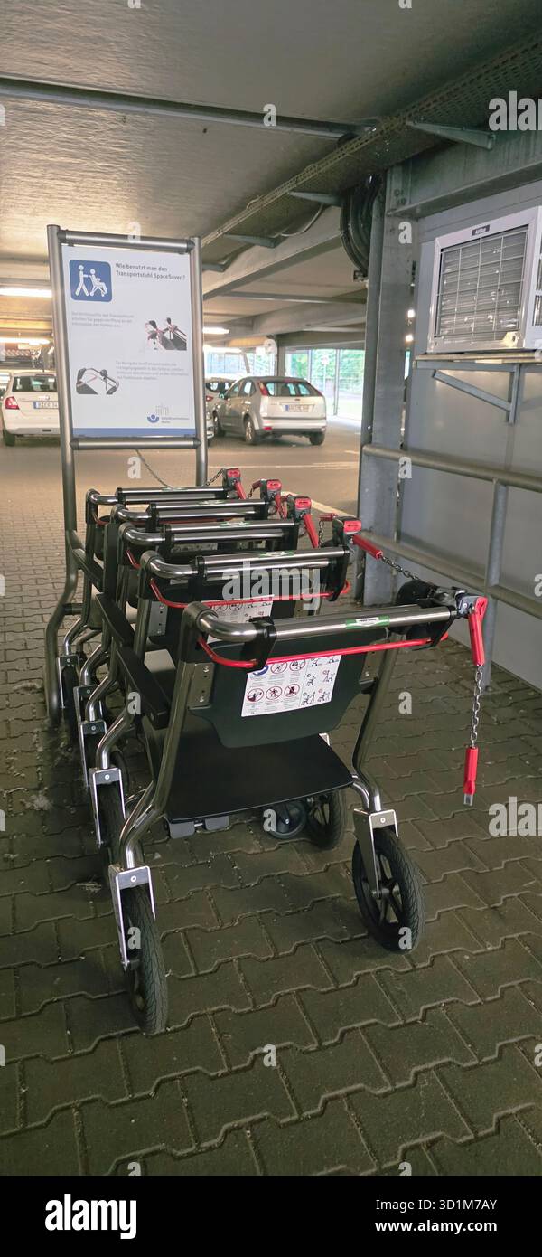 Belin, Germany - May 30, 2025: Accessible shopping carts are neatly arranged in a parking garage for easy access. Hospital - Smartphone Captured Stock Image