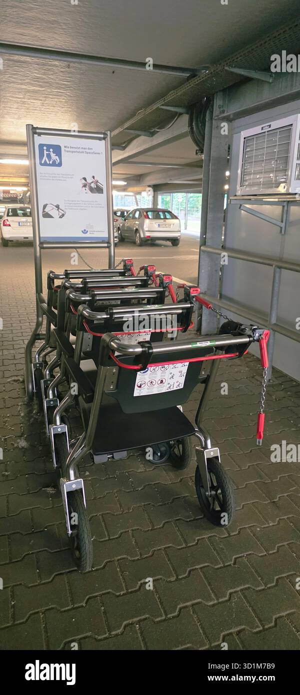 Belin, Germany - May 30, 2025: Accessible shopping carts are neatly arranged in a parking garage for easy access. Hospital - Smartphone Captured Stock Image
