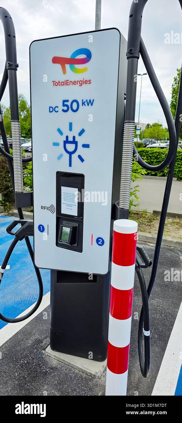 Berlin, Germany - May 03, 2025: TotalEnergies EV charging station features sleek design and user-friendly interface for electric vehicles. - Smartphone Captured Stock Image