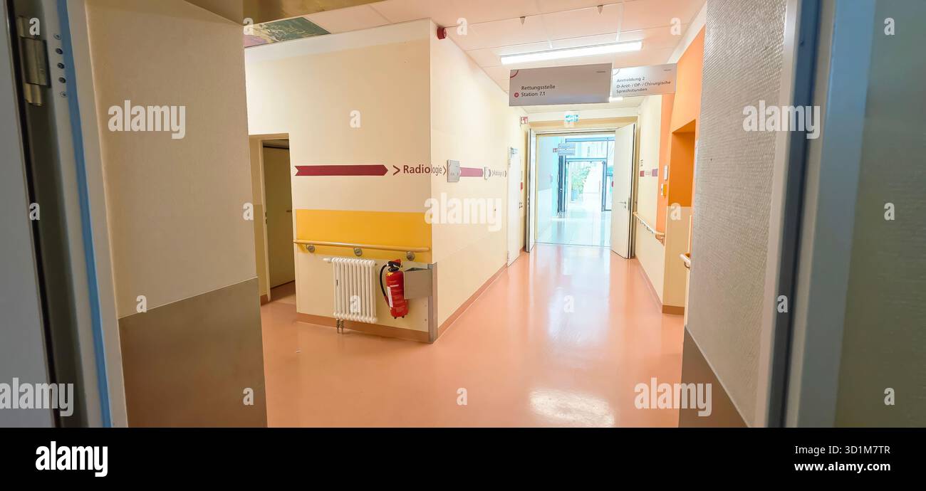 Berlin, Germany - June 16, 2025: Hospital corridor features directional signs and modern design elements in a clean environment. - Smartphone Captured Stock Image
