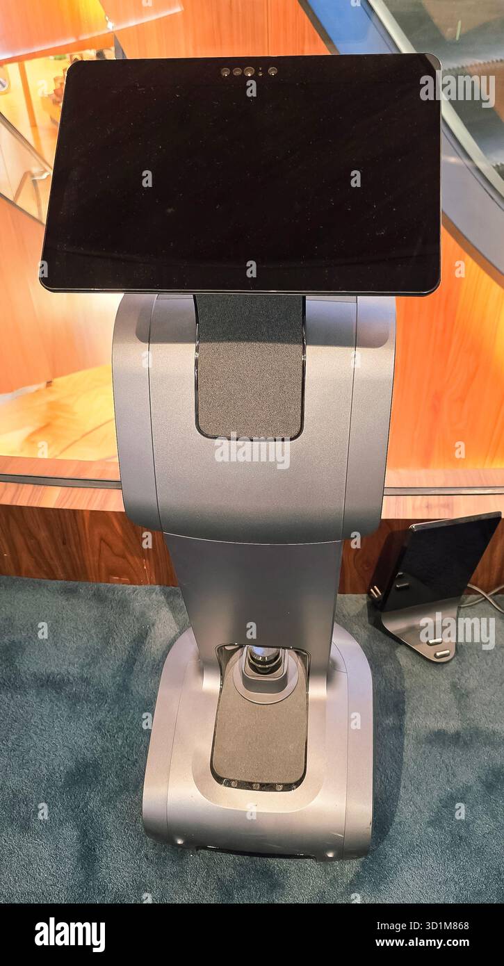 Berlin, Germany - June 11, 2025: Modern robotic kiosk features a touchscreen display in a sleek, contemporary environment. - Smartphone Captured Stock Image