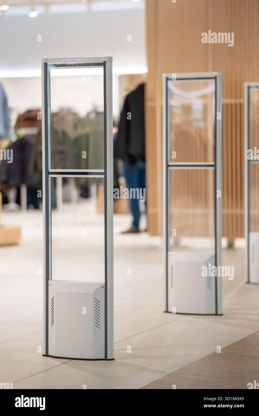 A sleek, transparent security gate stands at the entrance of a modern ...