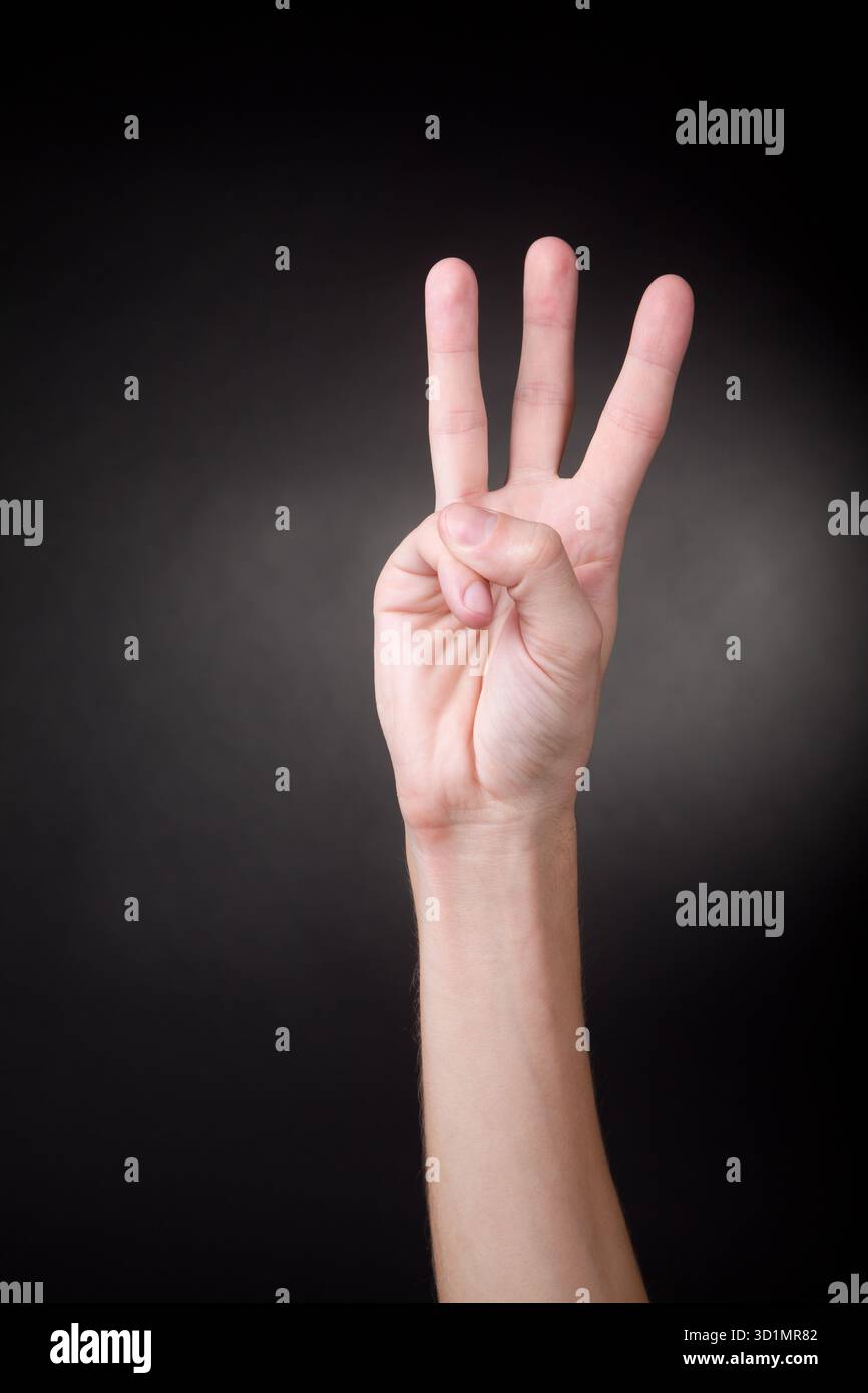 Hand showing number three Stock Photo