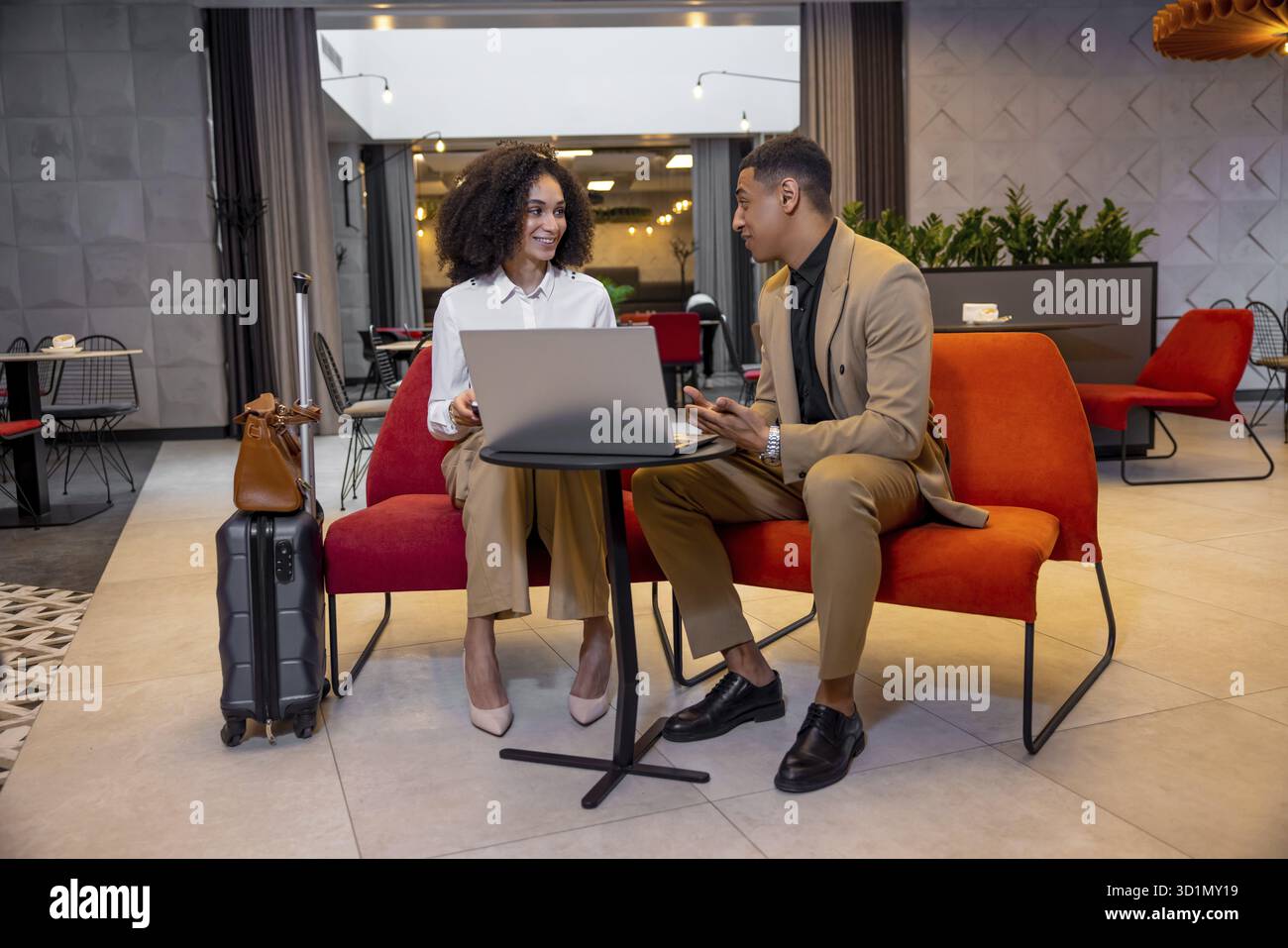 New project. Business partners discussing new project and looking involved Stock Photo