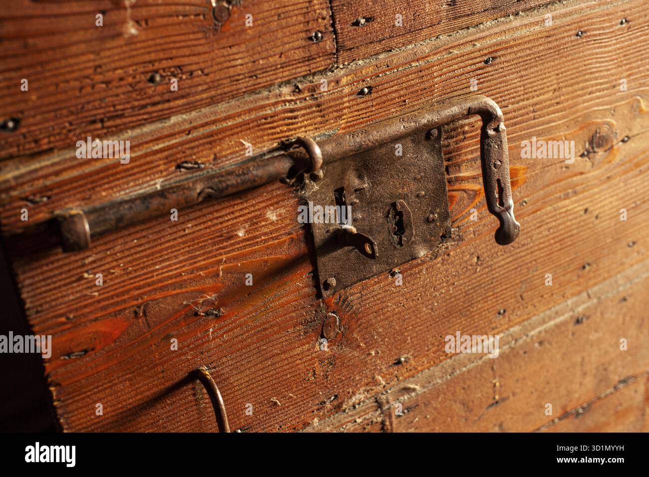 Detail of Deadbolt on old wooden door Stock Photo