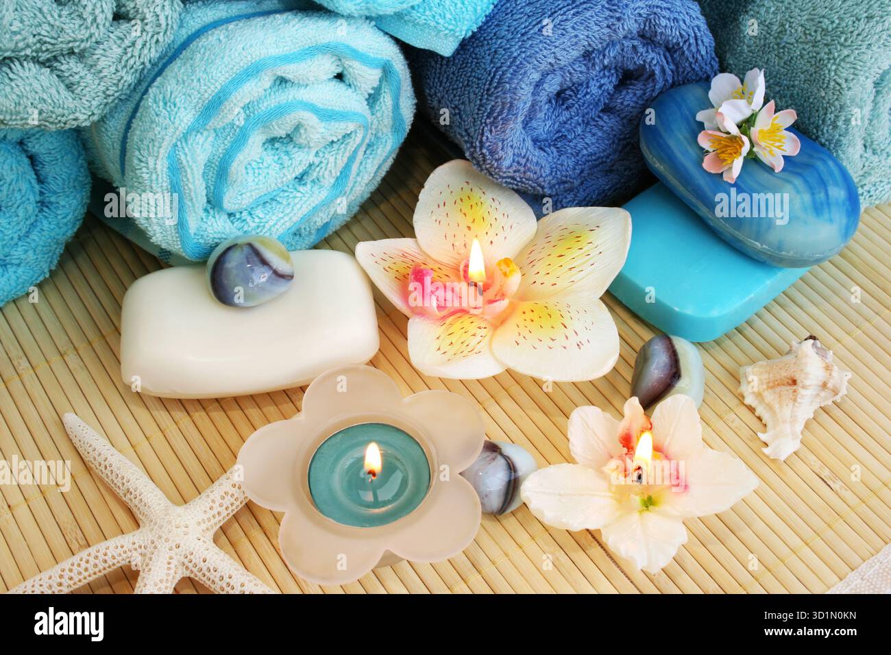 Towels, soaps, flowers, candles Stock Photo