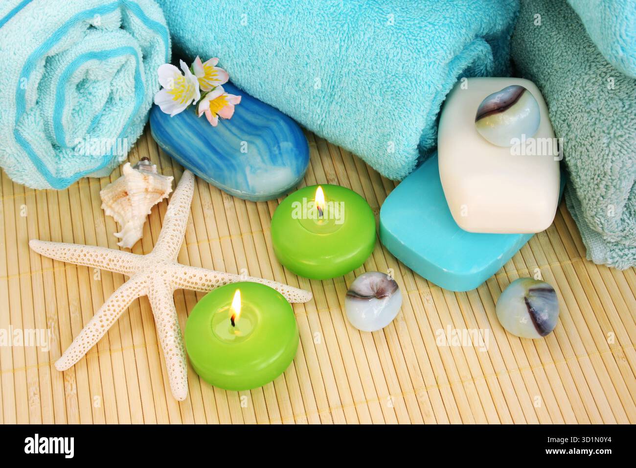 Towels, soaps, flowers, candles Stock Photo