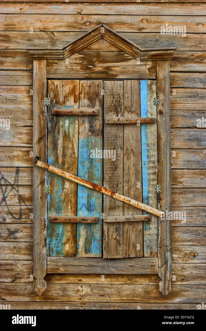 Weathered wooden window in slums Stock Photo