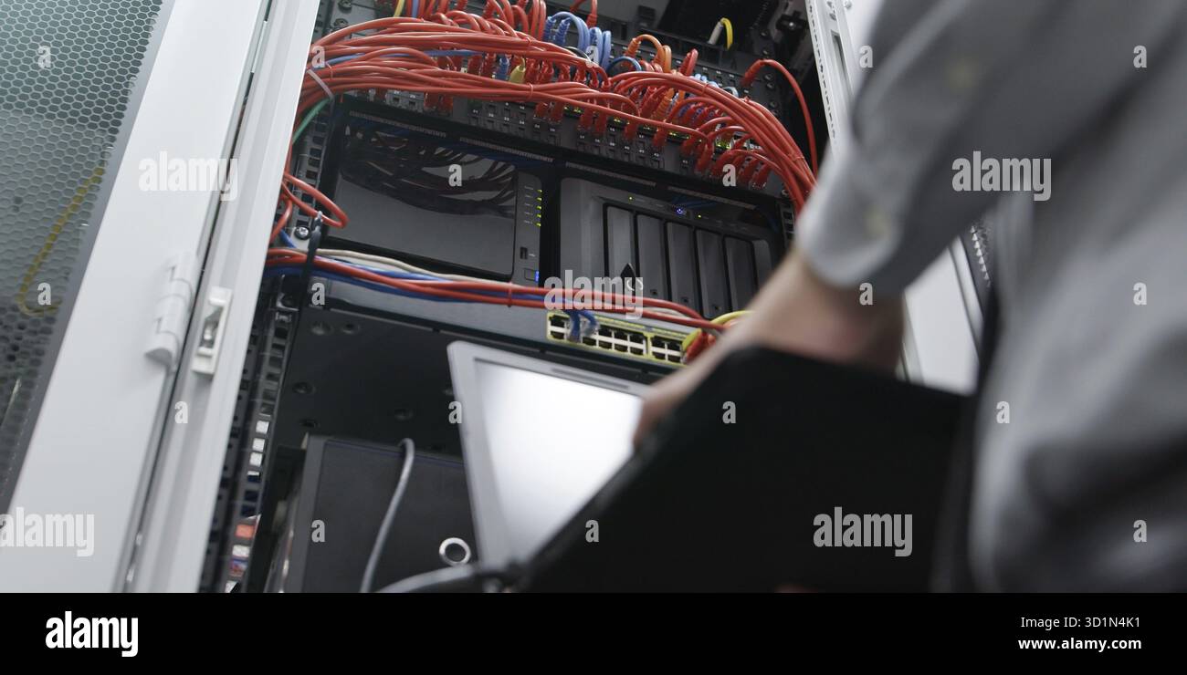 IT expert checking supercomputer server Stock Photo