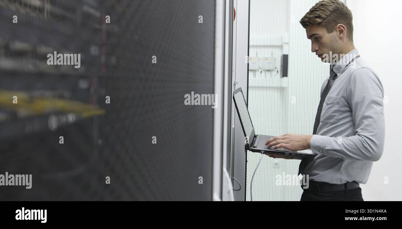 IT expert checking supercomputer server Stock Photo