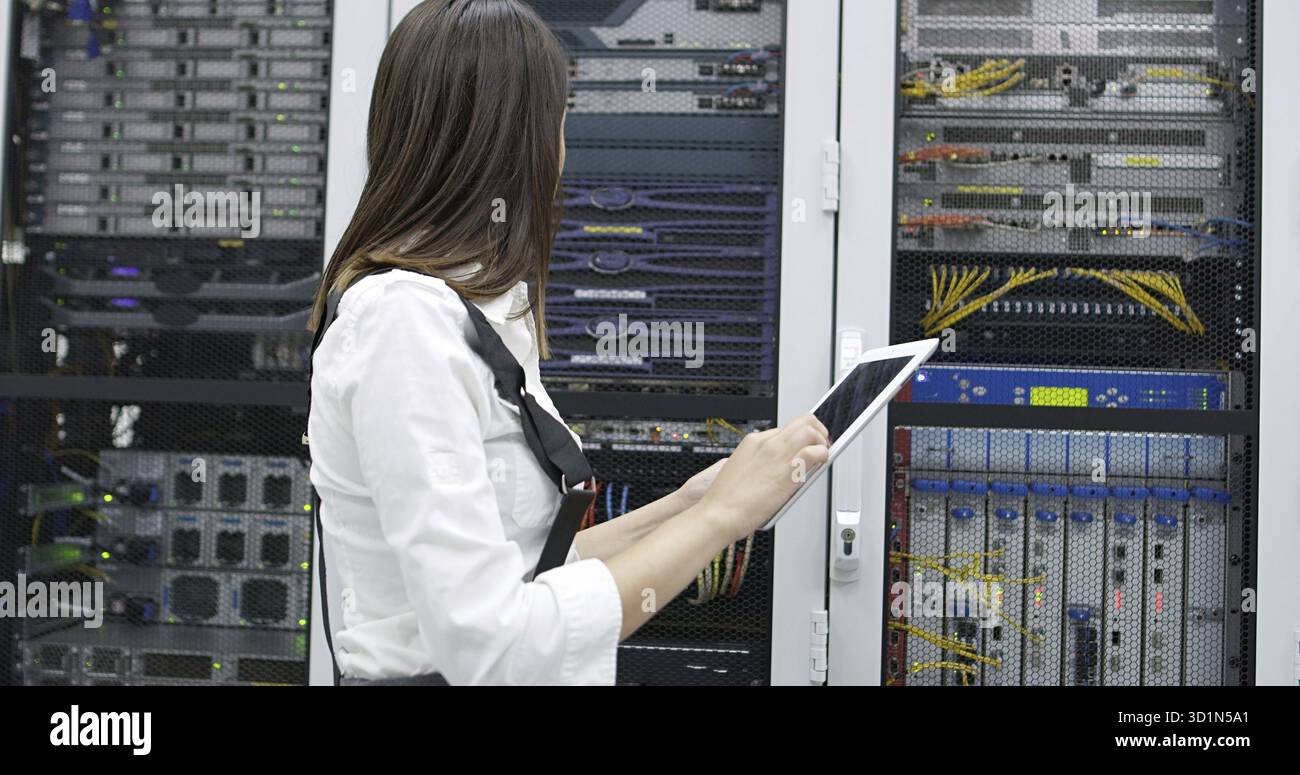 Female administrator at server room Stock Photo
