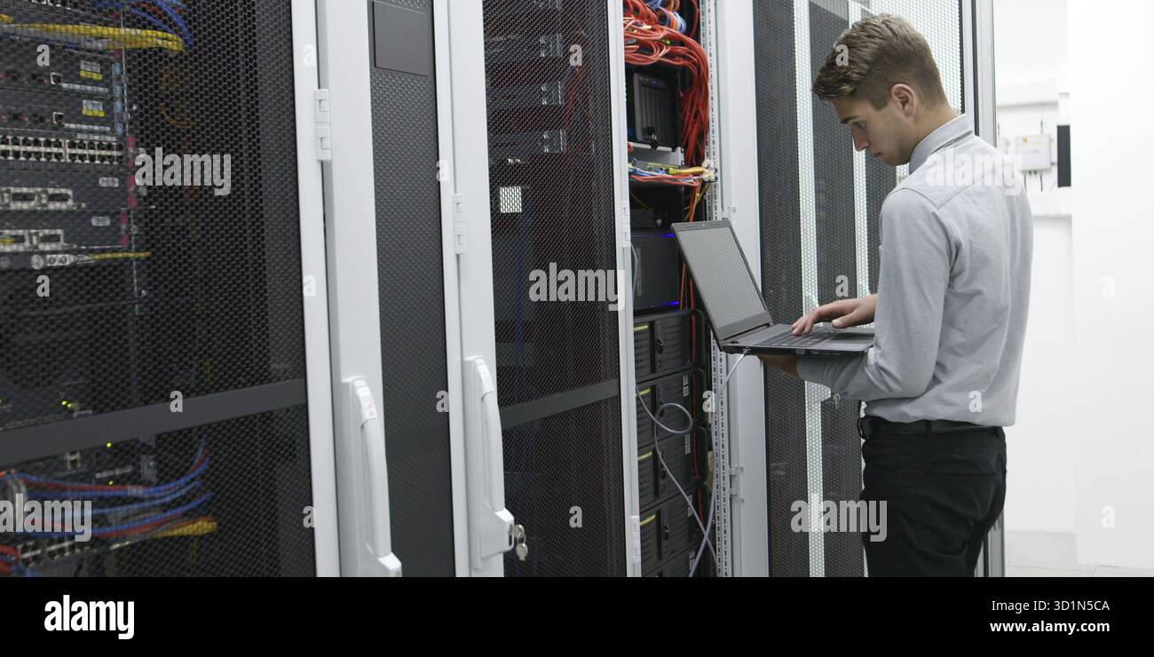 IT expert checking supercomputer server Stock Photo