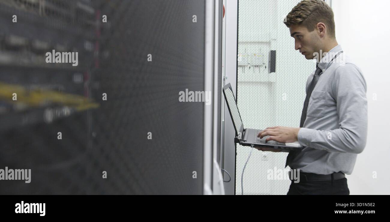 IT expert checking supercomputer server Stock Photo