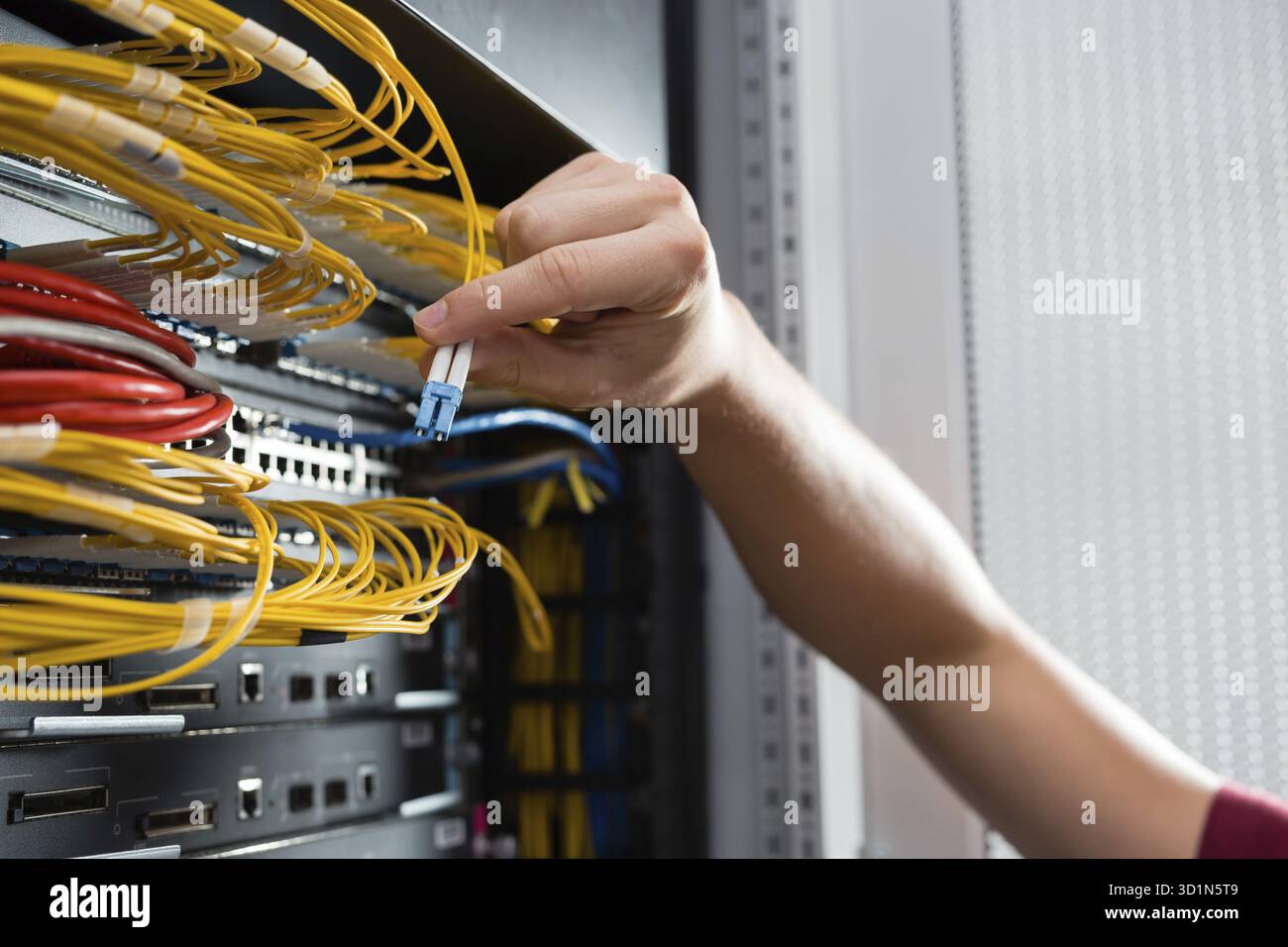 Man fix server network in data center room Stock Photo