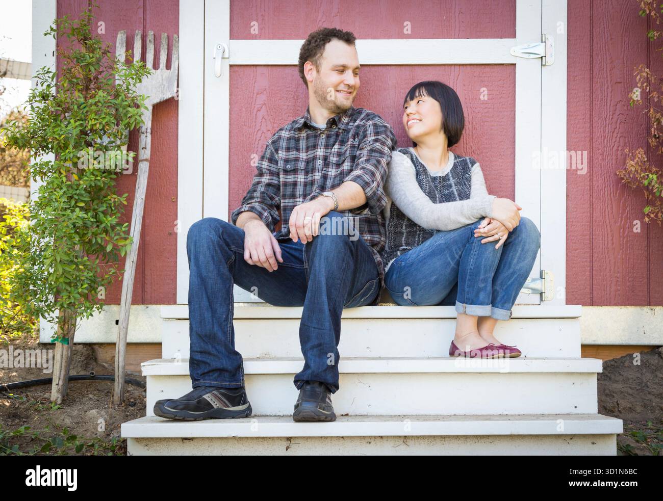 Mixed Race Couple Relaxing on the Steps Stock Photo