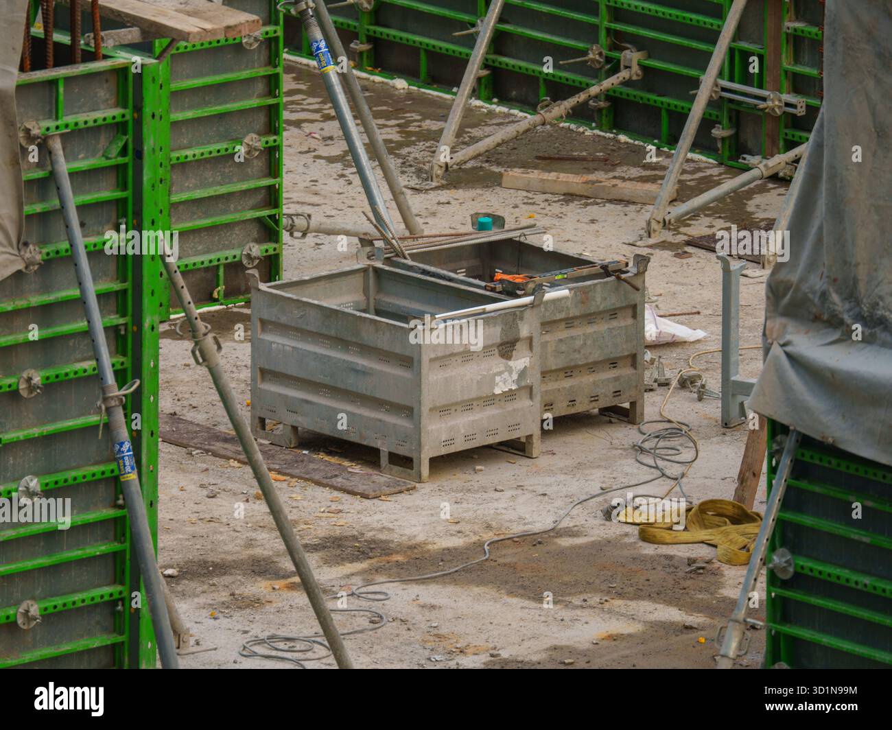 Construction Site with Rebar, Formwork, and Building Materials Stock Photo