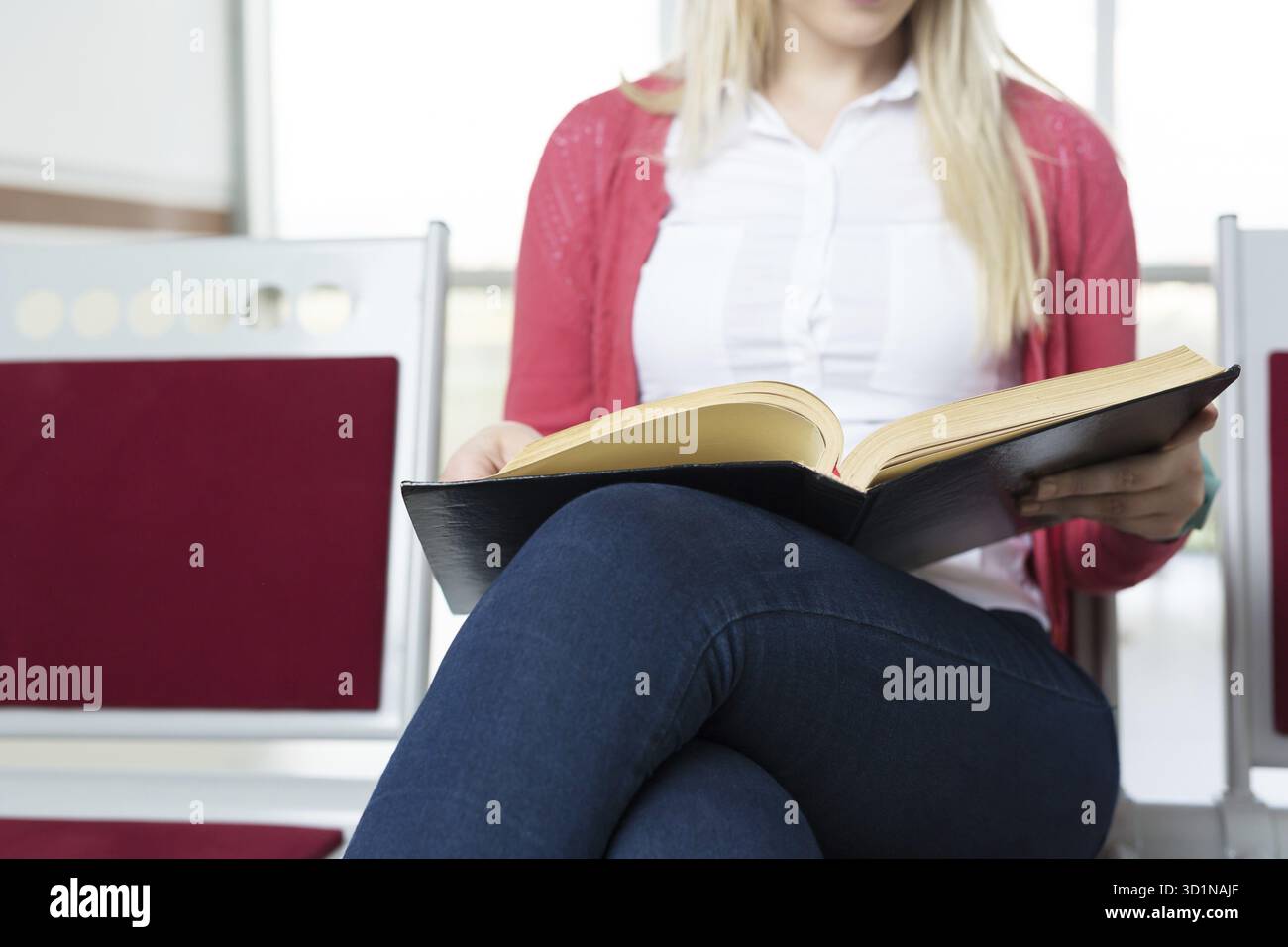 Student preparing exam and learning lessons in school library, making research Stock Photo