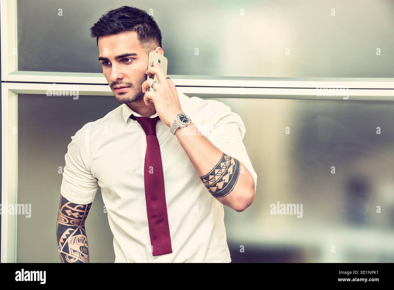 Handsome young businessman talking on cell phone Stock Photo