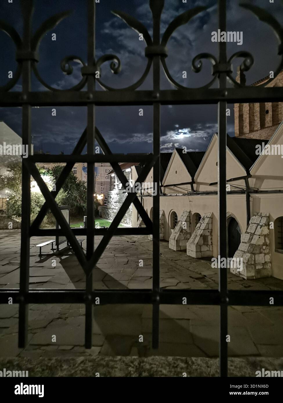 The Old Synagogue, Kazimierz, Krakow – moonlit Jewish landmark with Star of David in iron fence, historic architecture in Poland’s Jewish Quarter. - Smartphone Captured Stock Image