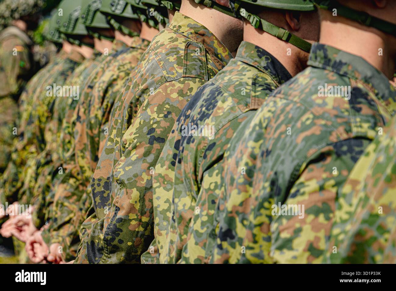 German Bundeswehr soldiers stand in formation wearing combat uniforms ...