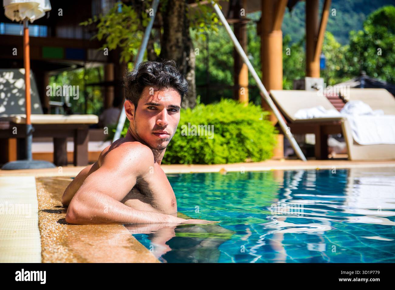 Man At Pool Smiling man relaxing in swimming pool Stock Photo - Alamy