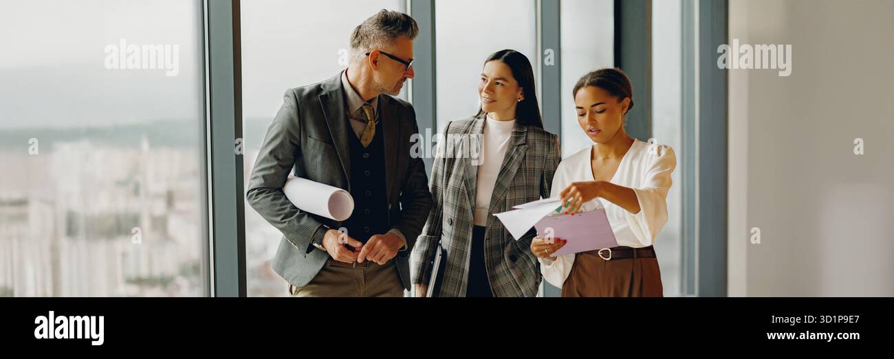 Business Team Engaging in Collaborative Discussions Within a Modern Office Space Environment Stock Photo