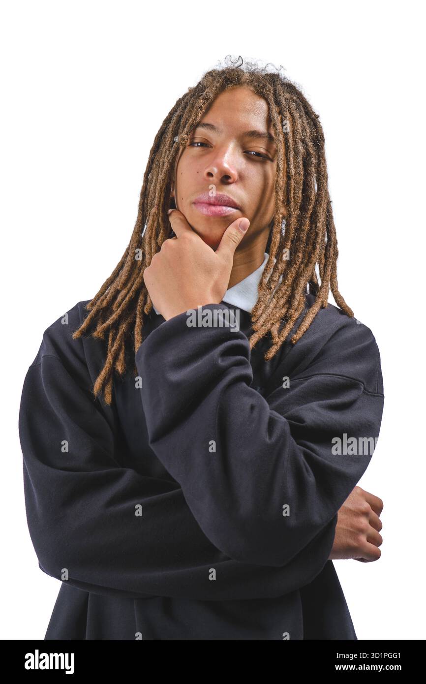 Young man with dreadlocks on a white background, contemplating thoughtfully Stock Photo
