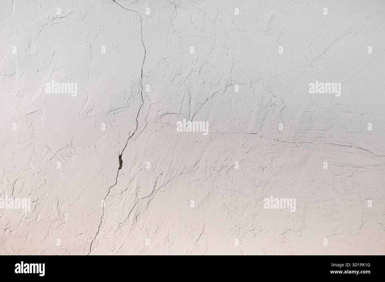 White Plastered Wall with Cracks - background or texture Stock Photo