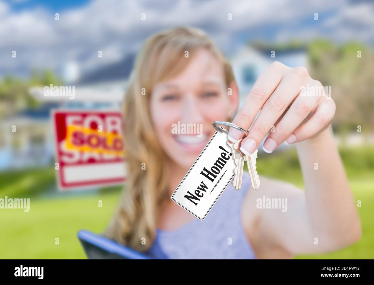 Woman Holding New House Keys with New Home Card In Front of Sold Real ...