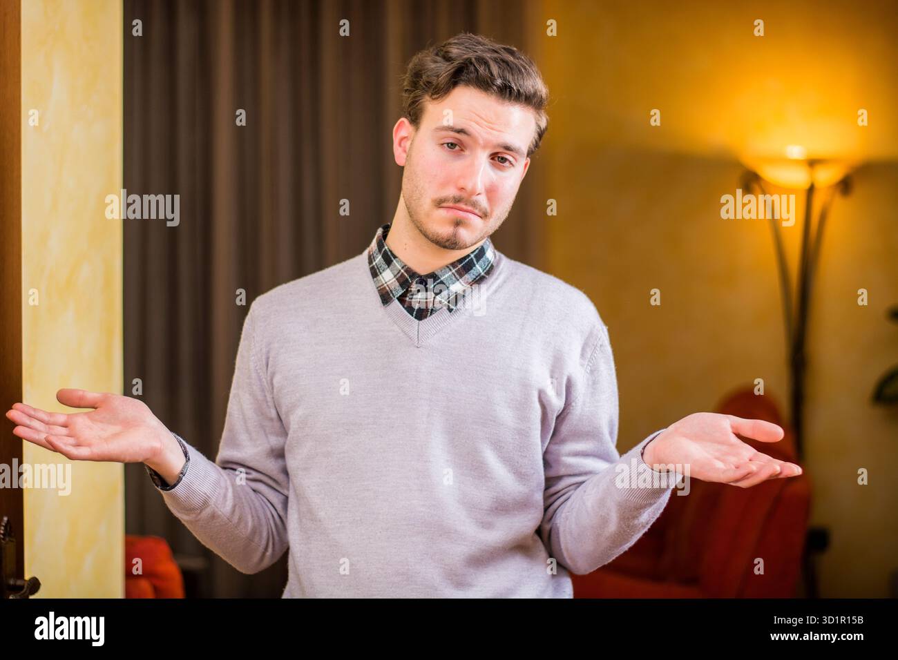 Confused young business man hi-res stock photography and images - Alamy
